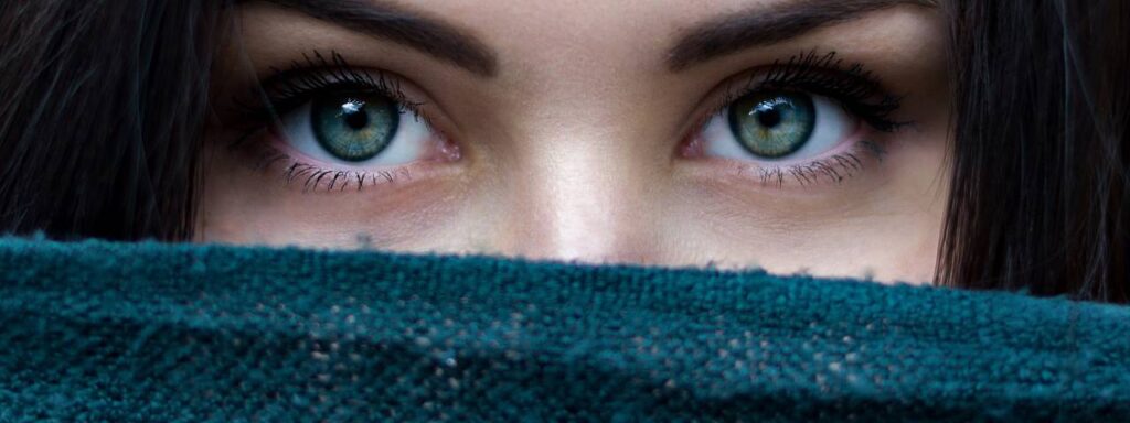 Woman Eyes Scarf Over Face